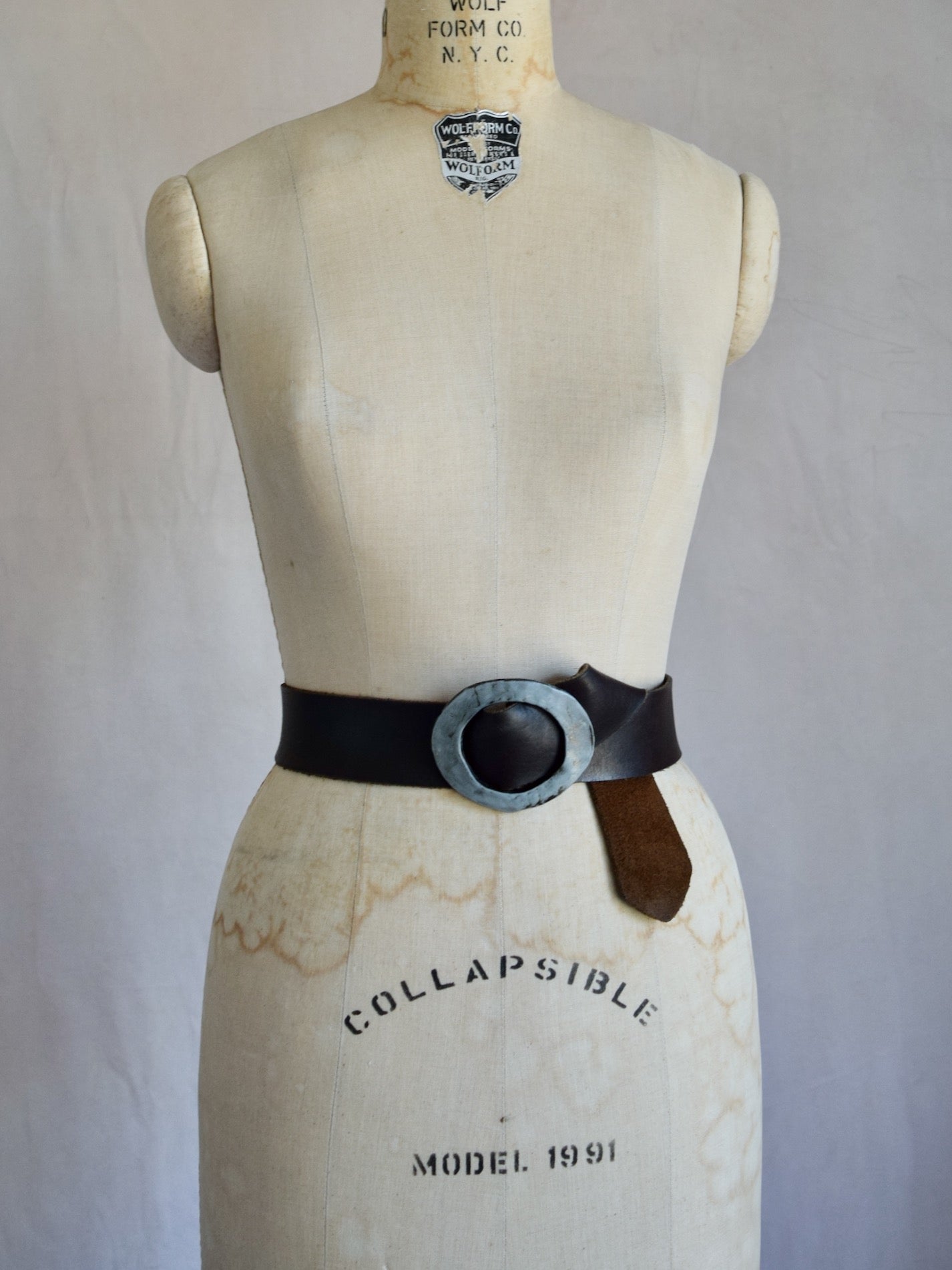 vintage 1970s dark brown leather belt with hammered metal buckle