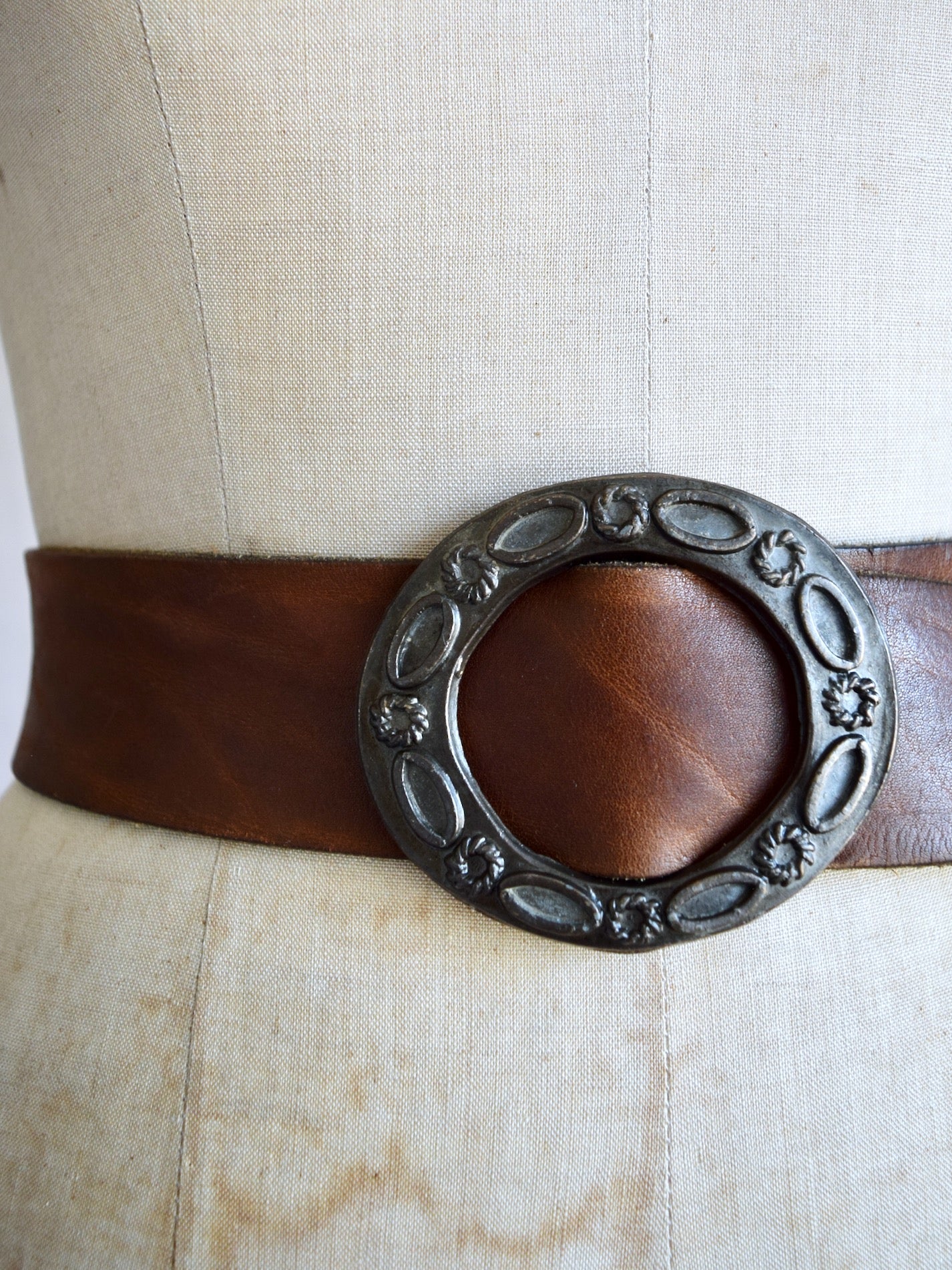 vintage 1970s medium brown leather belt with cast metal buckle
