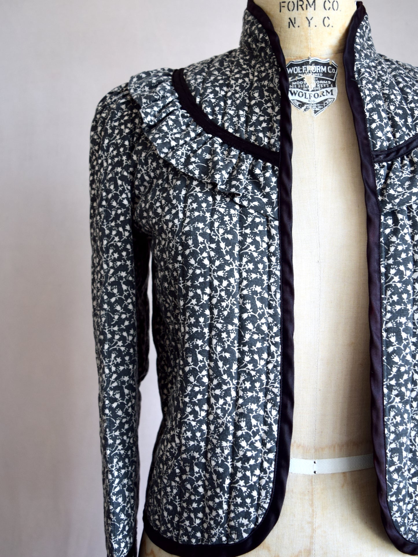 Vintage 1970s black and white calico print quilted jacket
